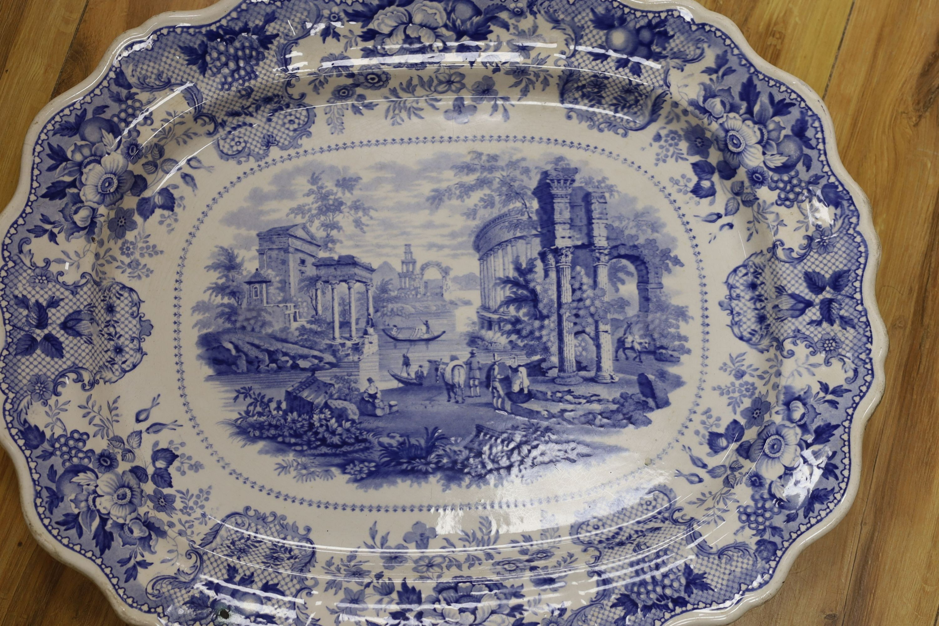 A large Victorian blue-printed stone china meat plate depicting 'Venetian scenery' - 54cm long